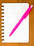notebook paper & pink pen