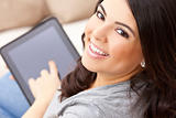 Happy Hispanic Woman Using Tablet Computer or iPad