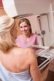 Nurse Assisting Patient Undergoing Mammogram