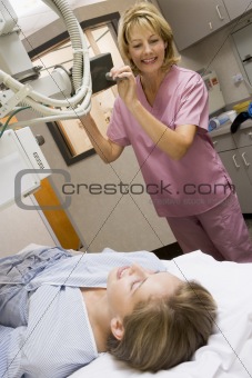 Nurse With Patient Having An X-Ray