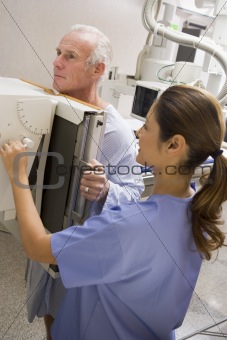 Nurse With Patient Having An X-Ray