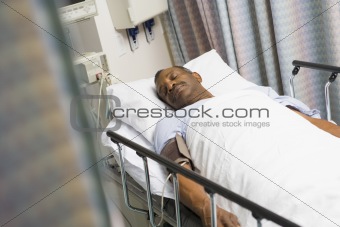 Patient Sleeping In Hospital Bed 