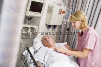 Doctor Checking Patient's Heartbeat