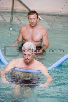 Instructor And Patient Undergoing Water Therapy