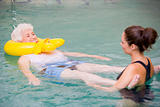 Instructor And Elderly Patient Undergoing Water Therapy