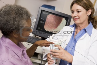 Doctor Performing Check-Up On Patient