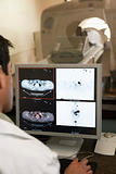 Doctor Monitoring Patient  Having Computerized Axial Tomography 