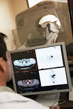 Doctor Monitoring Patient  Having Computerized Axial Tomography 