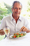 Senior Man Eating An Al Fresco Lunch