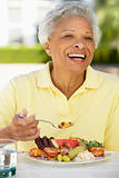 Senior Woman Dining Al Fresco
