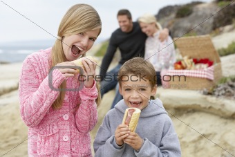 Family Dining Al Fresco At The Beach