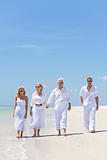 Four People, Two Seniors, Family Couples, Walking On Tropical Be