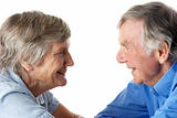Portrait of senior couple smiling at each other