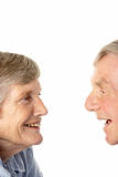 Portrait of senior couple smiling at each other