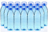 plastic bottles of mineral water in a three row