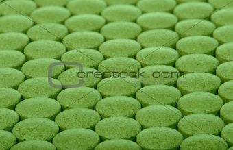 closeup background of green pills
