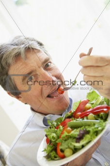 Senior Man Eating Salad