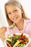 Young Girl Eating Fresh Salad