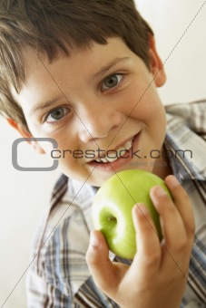 Young Boy Eating Apple