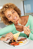 Mid Adult Woman Eating Unhealthy Fried Breakfast