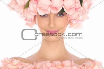 young woman in hat and dress of pink roses