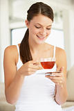 Young Woman Drinking Herbal Tea