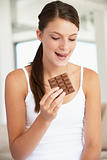 Young Woman Eating Chocolate