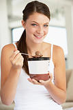 Young Woman Eating Chocolate Ice-Cream