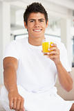 Young Man Drinking Orange Juice