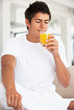 Young Man Drinking Orange Juice
