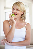 Mid Adult Woman Eating Green Apple