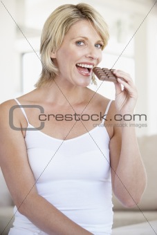 Mid Adult Woman Eating Chocolate