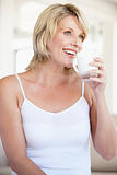 Mid Adult Woman Drinking A Glass Of Milk