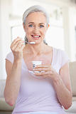 Senior Woman Eating Yogurt