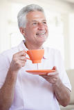 Middle Aged Man Holding Orange Mug
