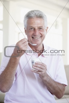 Middle Aged Man Eating Yogurt