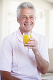 Middle Aged Man Drinking Orange Juice