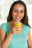 Teenage Girl Drinking Fresh Orange Juice