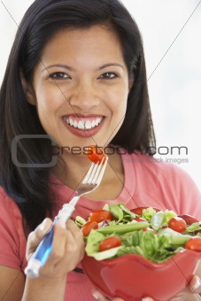 Mid Adult Woman Holding A Bowl Of Salad, Smiling At The Camera