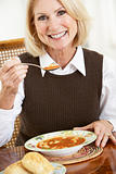 Senior Woman Drinking Soup