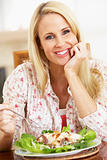Mid Adult Woman Eating A Healthy Meal, Smiling At The Camera