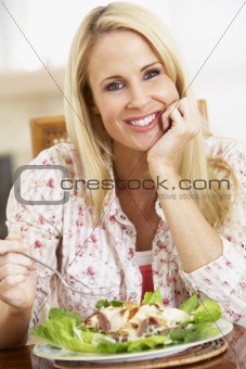 Mid Adult Woman Eating A Healthy Meal, Smiling At The Camera