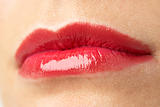 Extreme Close-Up Of Young Woman Wearing Red Lipstick