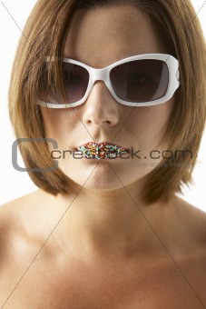 Young Woman Wearing Sunglasses With Sprinkles On Her Lips