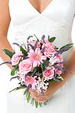 Bride Holding Bouquet Of Flowers