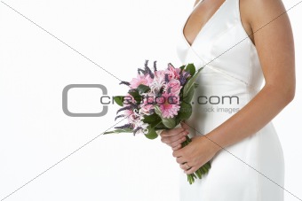 Bride Holding Bouquet Of Flowers
