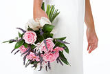 Bride Holding Bouquet Of Pink Flowers