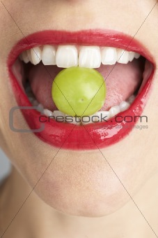 Woman Biting Grape