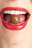 Woman Biting Chocolate