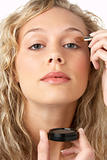 Young Woman Applying Make-Up